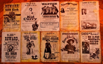 [Two rows of five posters each. Many are yellowed due to age.]